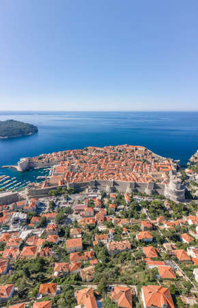 Aerial drone shot of Dubrovink city old town with view of Lokrum island in Croatia summer morningの写真素材