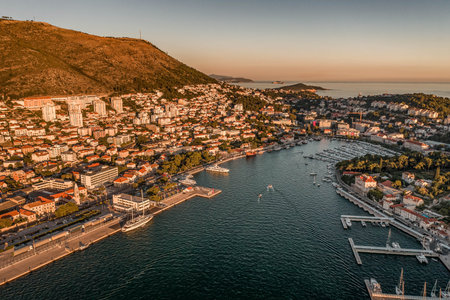 Aerial drone shot of Lapa Gruz port in Dubrovnik in Croatia summer sunset