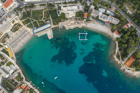 Aerial overhead drone shot of sunset beach in Dubrovnik by Dalmatia coastline in Croatia summerの写真素材