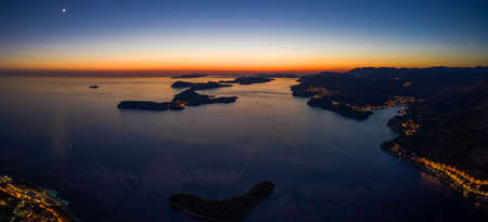 Aerial panorama drone shot of sunset horizon in Adriatic islands in Dubrovnik in Croatia summerの写真素材