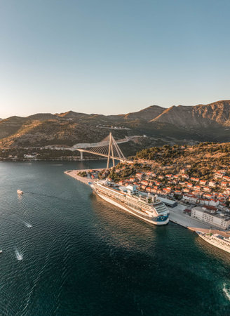Aerial drone shot of cruise ship at Port Gruz in dalmatia coastline in Croatia summer sunsetの写真素材