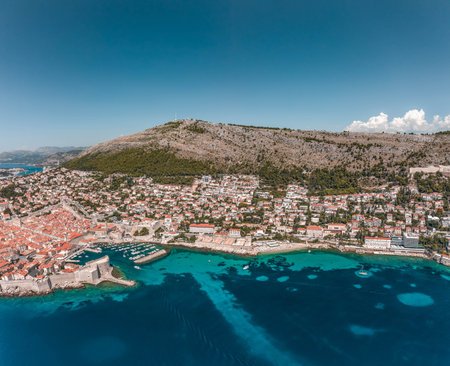 Aerial drone shot of Dubrovnik old town Banje beach in Adriatic sea in Croatia summerの写真素材