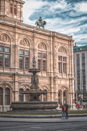 Vienna, Austria - April 27,2019: Tourists looking at maps by the Opernbrunnen fountain besides State Opera Houseのeditorial素材