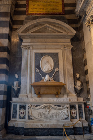 Pisa Cathedral, Italy - August 14, 2021: Tomb of Archbishop Francesco Moricotti with Marble Carvings and Papal Symbolsのeditorial素材