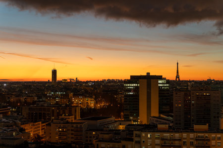Sunrise View of Eiffel Tower and regency Tower against Golden Hour orange Sky in Paris morningの写真素材
