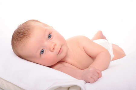 baby laying on side lookingの写真素材