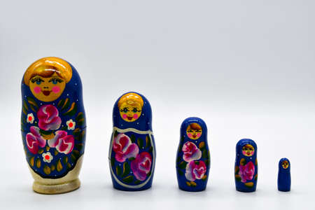 Classic Russian matryoshkas in row on put with white backgroundの写真素材