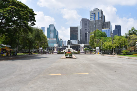 BANGKOK, THAILAND March 19, 2019 Exit from Lumphini Park with many skyscrapers in Bangkok