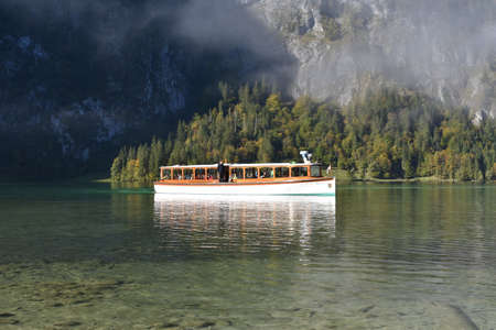 BERCHTESGADEN, GERMANY October 05, 2018 Arrival of an electric boat at the Obersee stop in Berchtesgaden in the morningのeditorial素材