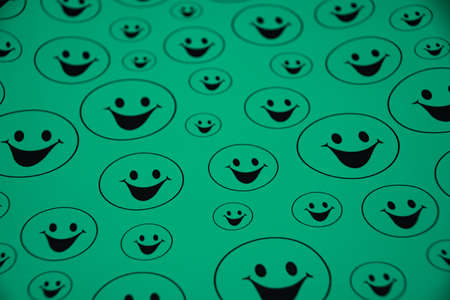 Lots of mint green smiling big and small smileysの写真素材