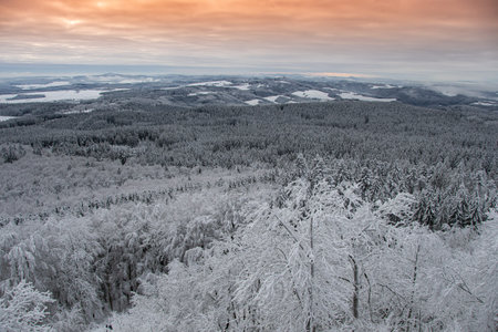 The view from the highest mountain in the Eifel on a breathtaking winter landscape with a great skyの写真素材