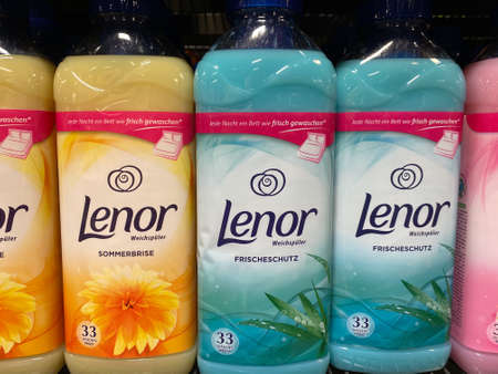 Several bottles of Lenor fabric softener on the shelf of a German supermarketのeditorial素材