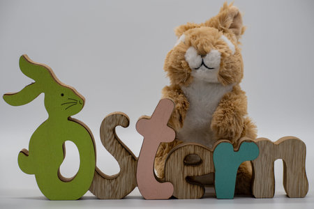 The German word Easter as a decoration with an Easter bunny