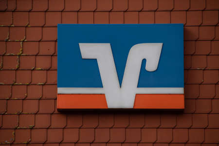 Greetsiel, Germany 12 March 2021, The brand logo of "Volksbank Raiffeisenbank" from a branch in Greetsielのeditorial素材