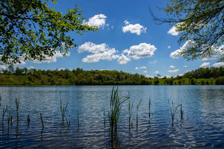 The view of the Weinfelder Maar on a sunny spring dayの写真素材
