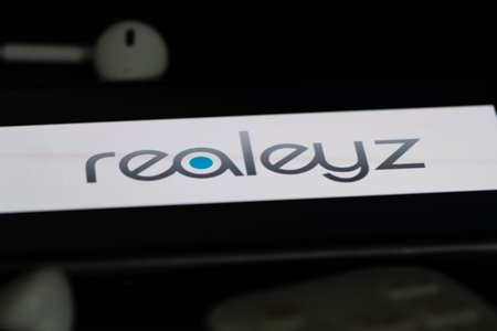 Closeup of smartphone screen with logo lettering of online shopping store realez