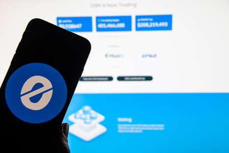 Rheinbach, Germany 13 January 2022, The logo of the cryptocurrency "Origin Protocol" on the display of a smartphone in front of the website ( focus on logo )のeditorial素材