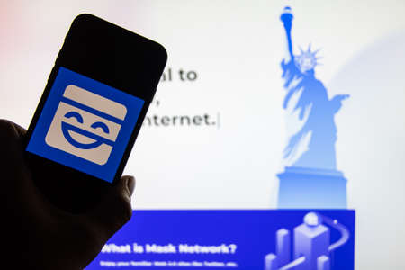 Rheinbach, Germany 13 January 2022, The logo of the cryptocurrency "Mask Network" on the display of a smartphone in front of the website (focus on logo)のeditorial素材