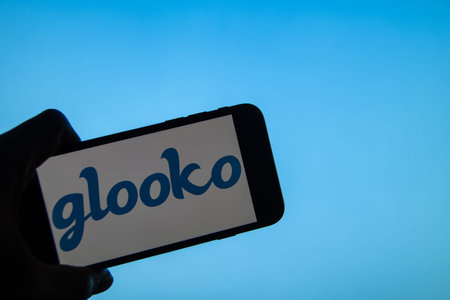 Rheinbach, Germany 2 February 2022, The brand logo of the American company Glooko on the display of...