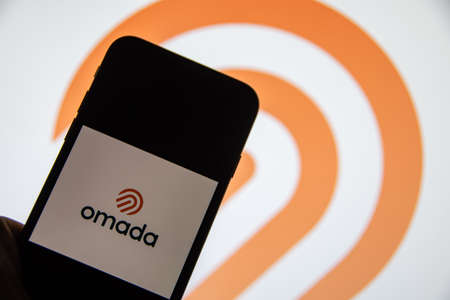 Rheinbach, Germany 24 March 2022, The "Omada Health" brand logo on the display of a smartphone (focus on the brand logo)のeditorial素材