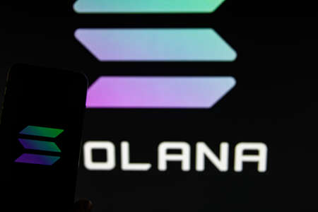 Rheinbach, Germany April 1, 2022, The logo of the cryptocurrency "Solana" on the display of a smartphone (focus on the logo)のeditorial素材
