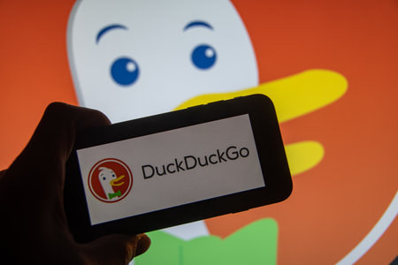 Rheinbach, Germany November 21, 2022, The brand logo of the Internet search engine "DuckDuckgo" on the display of a smartphone (focus on the brand logo)のeditorial素材