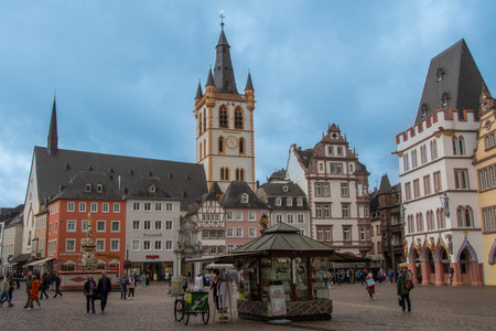 Trier, Germany  25 September 2024,  Historic market square in Trier with St. Gangolf Church,...
