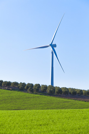 Windmill in the countryside land with blue sky background.の写真素材