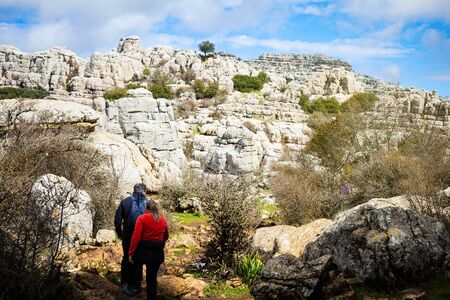 Couple hiking in the mountain. Stone and rocks landscape.の写真素材