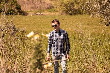 Rural portrait of man in sunglasses.の写真素材