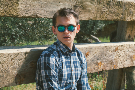 Blond man in sunglasses portrait.の写真素材