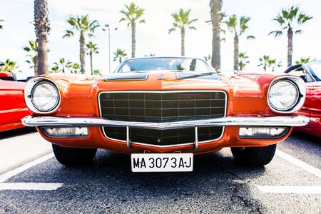 Benalmadena, Spain - June 21, 2015: Front view of classic 1972 Chevrolet Camaro in orange color, parked in Benalmadena (Spain), on June 21, 2015.のeditorial素材