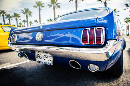 Benalmadena, Spain - June 21, 2015: Back view of classic Ford Mustang in blue color, parked in...