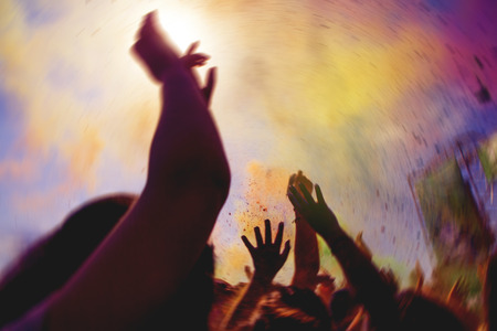 Crowd with hands up during a concert.の写真素材