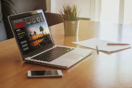 Tv series streaming service: Laptop computer with streaming website service in the screen.の写真素材