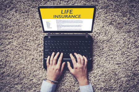 Life Insurance concept: Laptop computer with Life Insurance contract in the screen.の写真素材
