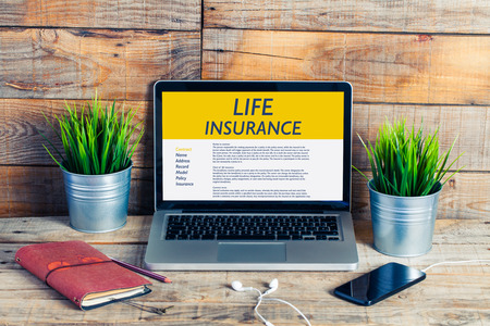 Life Insurance concept: Laptop computer with Life Insurance contract in the screen.の写真素材