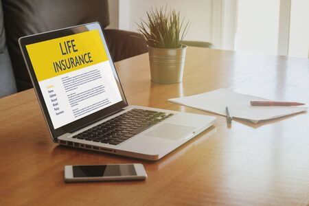 Life Insurance concept: Laptop computer with Life Insurance contract in the screen.の写真素材