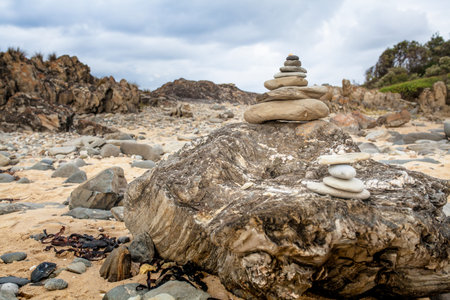 Zen pebble cairn placed at the coastline