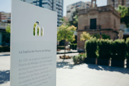 MALAGA, SPAIN - June 29, 2017: Information with text in Spanish in a white board about Malaga's Port Chapel, in Malaga, Spain.のeditorial素材