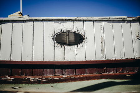Old sailboat porthole close up detail.の写真素材