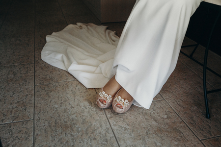 Detail of bridal shoes and dressの写真素材