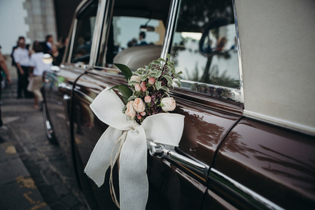 Wedding ornament decoration in a classic car.の写真素材
