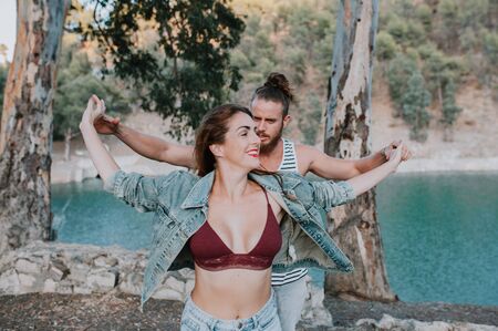 Happy couple dancing in natureの写真素材