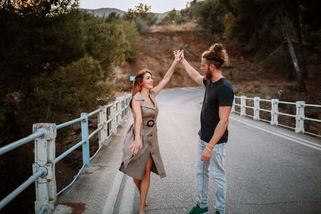 Hipster couple dancing together outdoorsの写真素材