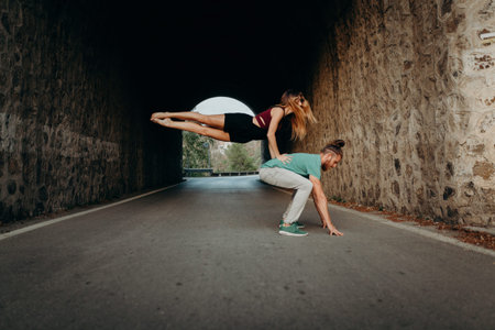Woman doing breakdance position with her boyfriend