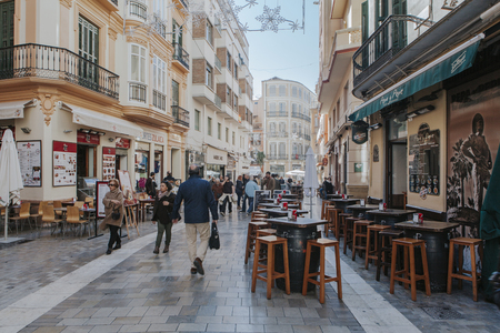 MALAGA, SPAIN - DECEMBER 5th, 2017: View of Malaga city center life, with people walking in the street and shops and restaurants around it, on December 5th, 2017.のeditorial素材