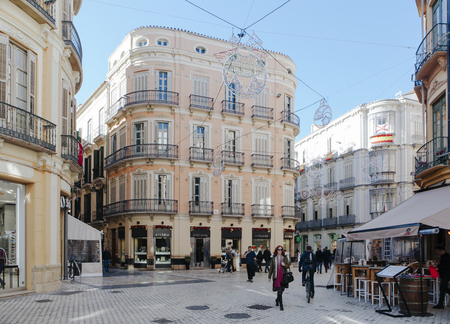 MALAGA, SPAIN - DECEMBER 5th, 2017: View of Malaga city center life, with people walking in the street and shops and restaurants around it, on December 5th, 2017.のeditorial素材
