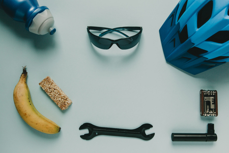 Cycling accessories and food with copy space on blue background.の写真素材