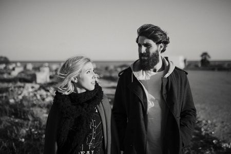 Cool couple enjoying together outdoors in the city suburbs. Black and white.の写真素材